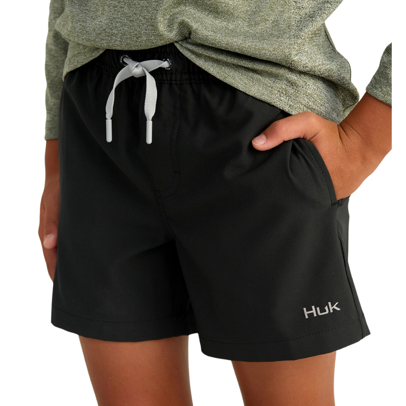 Black shorts with a visible brand logo worn by a person on a white background