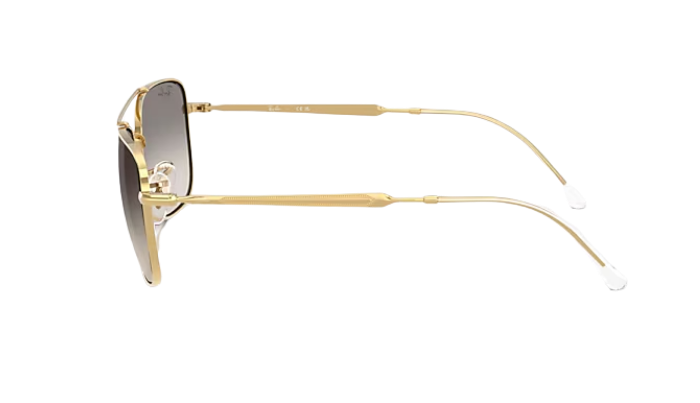 Gold-framed Ray-Ban sunglasses with gradient lenses on a white background