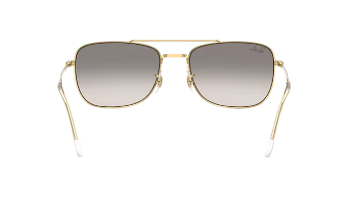 Gold-framed Ray-Ban sunglasses with gradient lenses on a white background