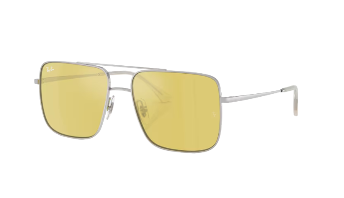 Sunglasses with yellow lenses and silver frame on a white background