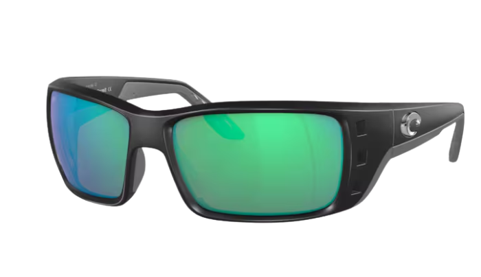 Black Costa wraparound sunglasses with green lenses on a white background