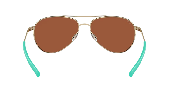 Costa Aviator sunglasses with green reflective lenses on a white background