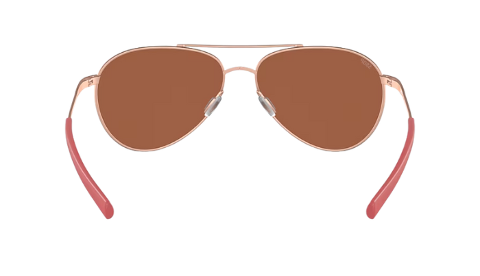 Costa Aviator sunglasses with rose gold frame and copper silver mirror lenses on a white background