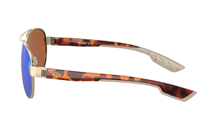 Aviator Costa sunglasses with green lenses and gold frame on a white background