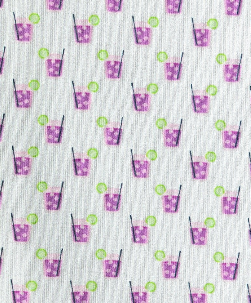 Pattern of purple transfusion drinks with straws and green lime slices on a white background