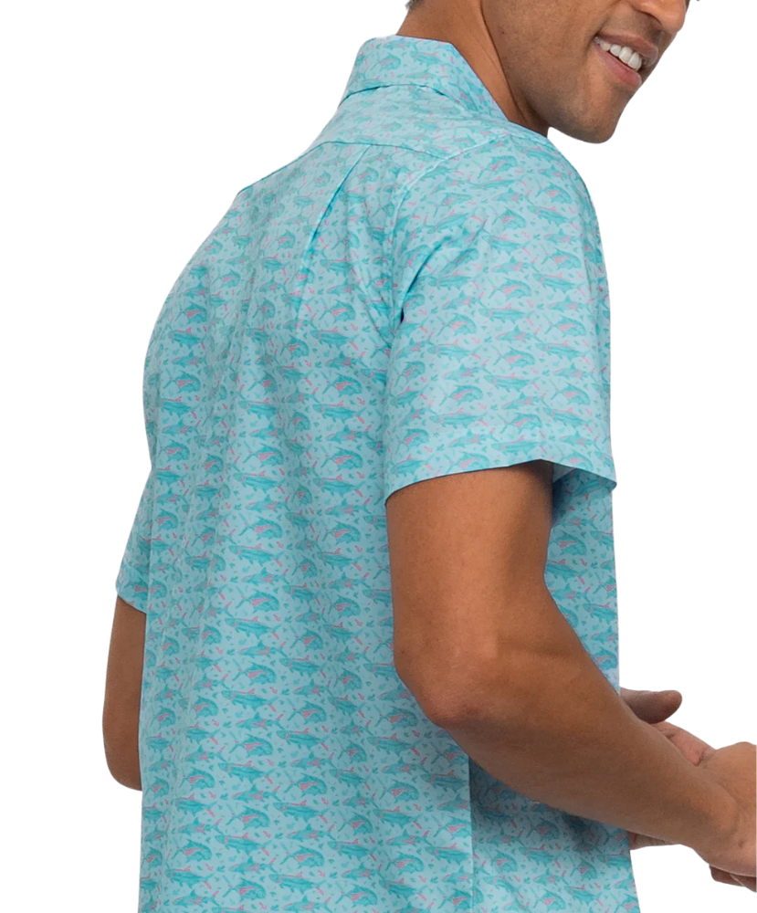 Man wearing a light blue patterned shirt on a white background
