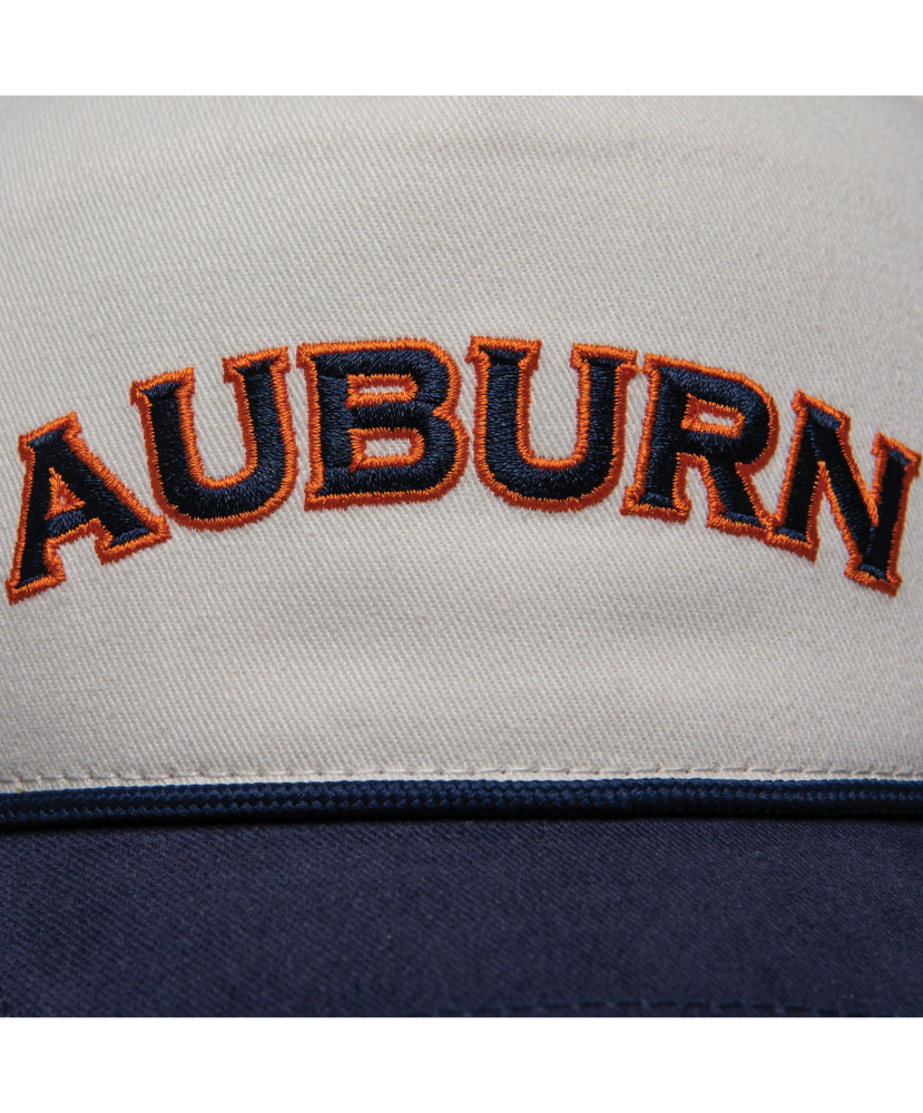 Close-up of a sports team logo with 'Auburn' text on a gray and navy HAT