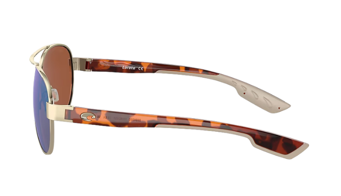 Aviator Costa sunglasses with green lenses and gold frame on a white background