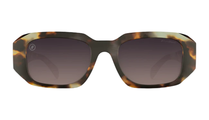 Sunglasses with tortoiseshell frame and dark lenses on a white background