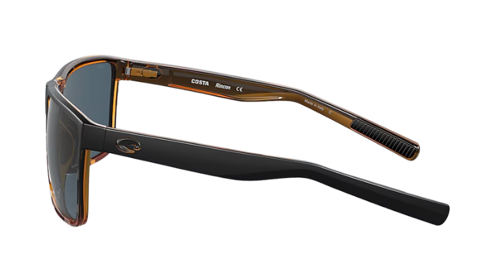 Costa Sunglasses with tortoiseshell frame and gray lenses on a white background