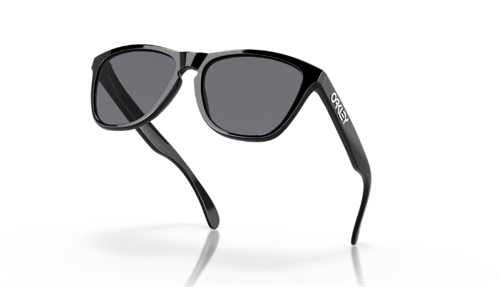 Black sunglasses with dark gray lenses and a white 'CREEX' logo on the temple, shown on a clean white background with a soft reflection.