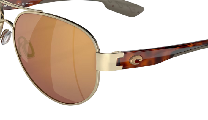 Gold-framed sunglasses with brown lenses on a white background