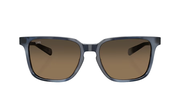 Costa Sunglasses with a blue tortoise frame and polarized copper gradient lenses on a white background
