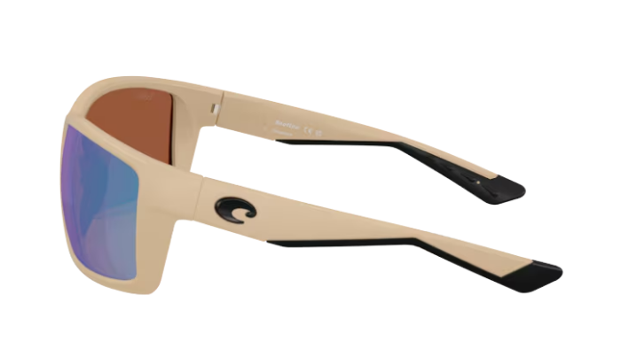 Beige Costa sunglasses with green polarized reflective lenses on a white background