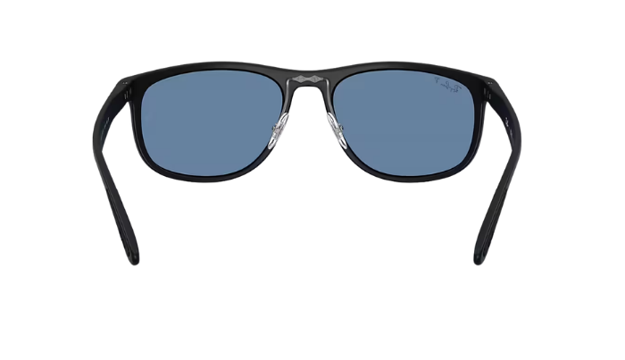 Black Ray-Ban RB4468 sunglasses with blue polarized lenses on a white background