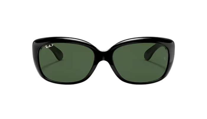 Black sunglasses with green lenses on a white background
