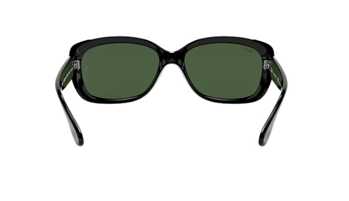 Black Ray-Ban sunglasses with green lenses on a white background