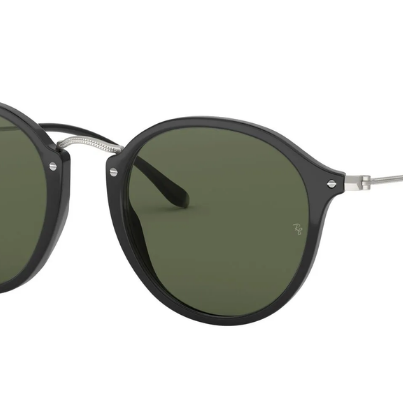 Round Ray-Ban sunglasses with black frames and green polarized lenses on a white background