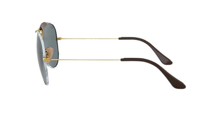 Aviator Ray-Ban sunglasses with denim gold frame and dark lenses on a white background