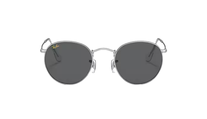 Round sunglasses with dark lenses and silver frame on a white background