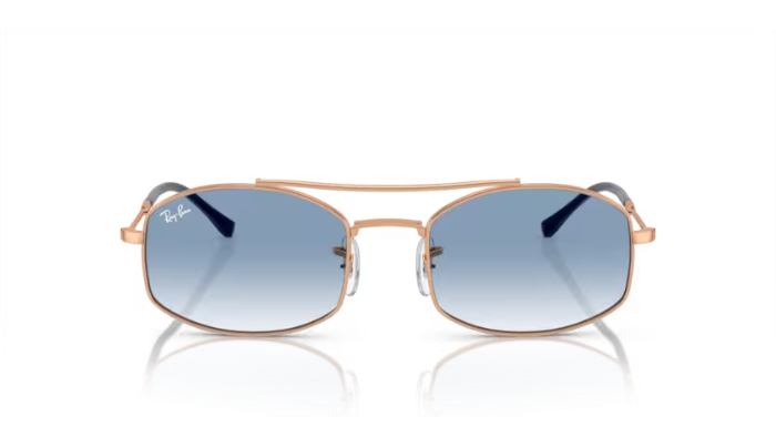 Sunglasses with blue gradient lenses and gold frame on a white background