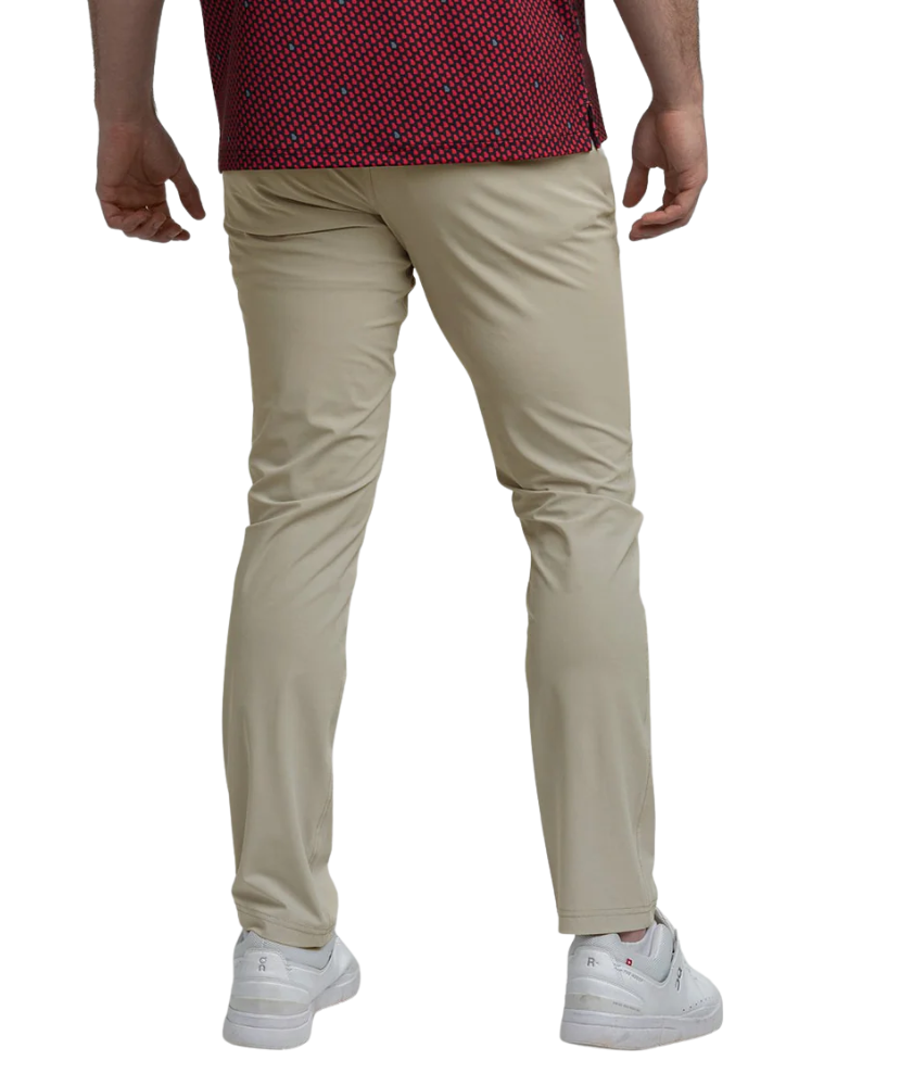 Beige pants worn by a person on a white background