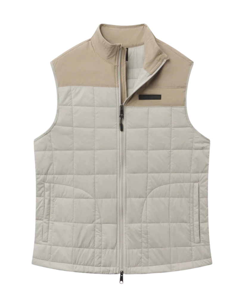 Two-tone quilted vest with beige and gray color scheme on a white background
