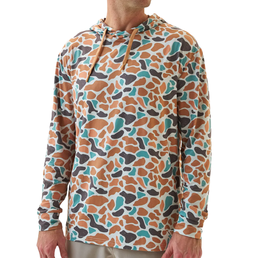 Man wearing a colorful patterned BURLEBO hoodie on a white background