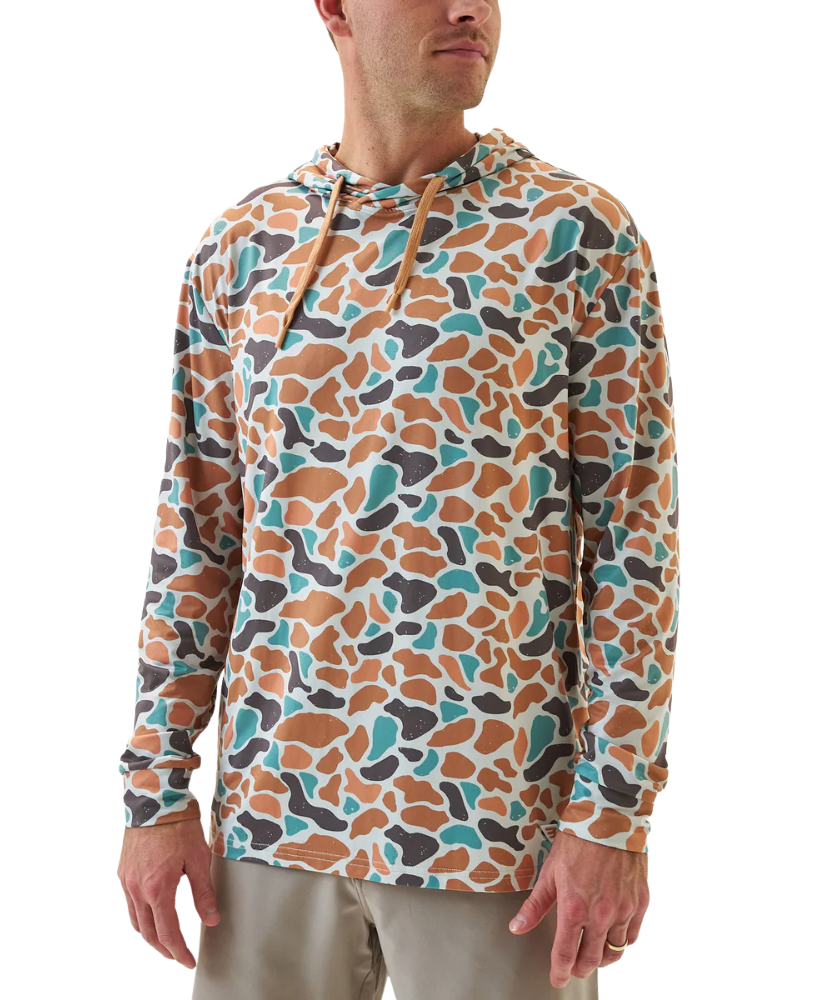 Man wearing a colorful patterned BURLEBO hoodie on a white background