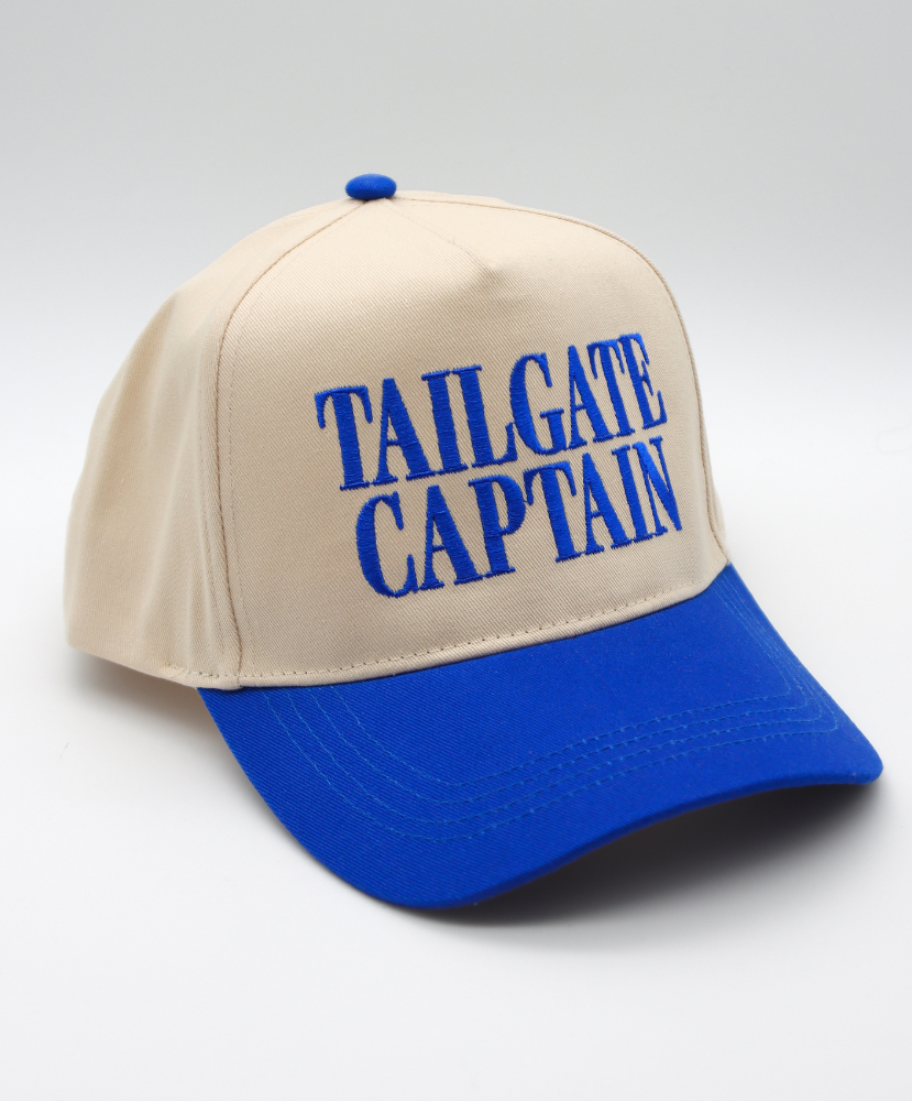 Beige and blue cap with 'TAILGATE CAPTAIN' text on a light gray background