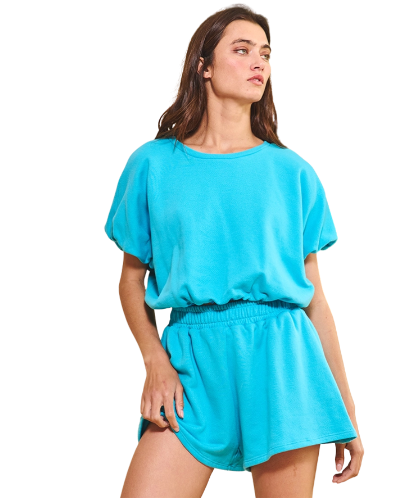 Woman wearing a blue outfit on a white background