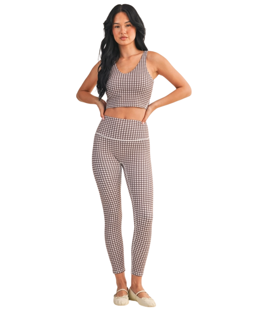 Woman wearing a brown and white GINGHAM checkered tank on a white background