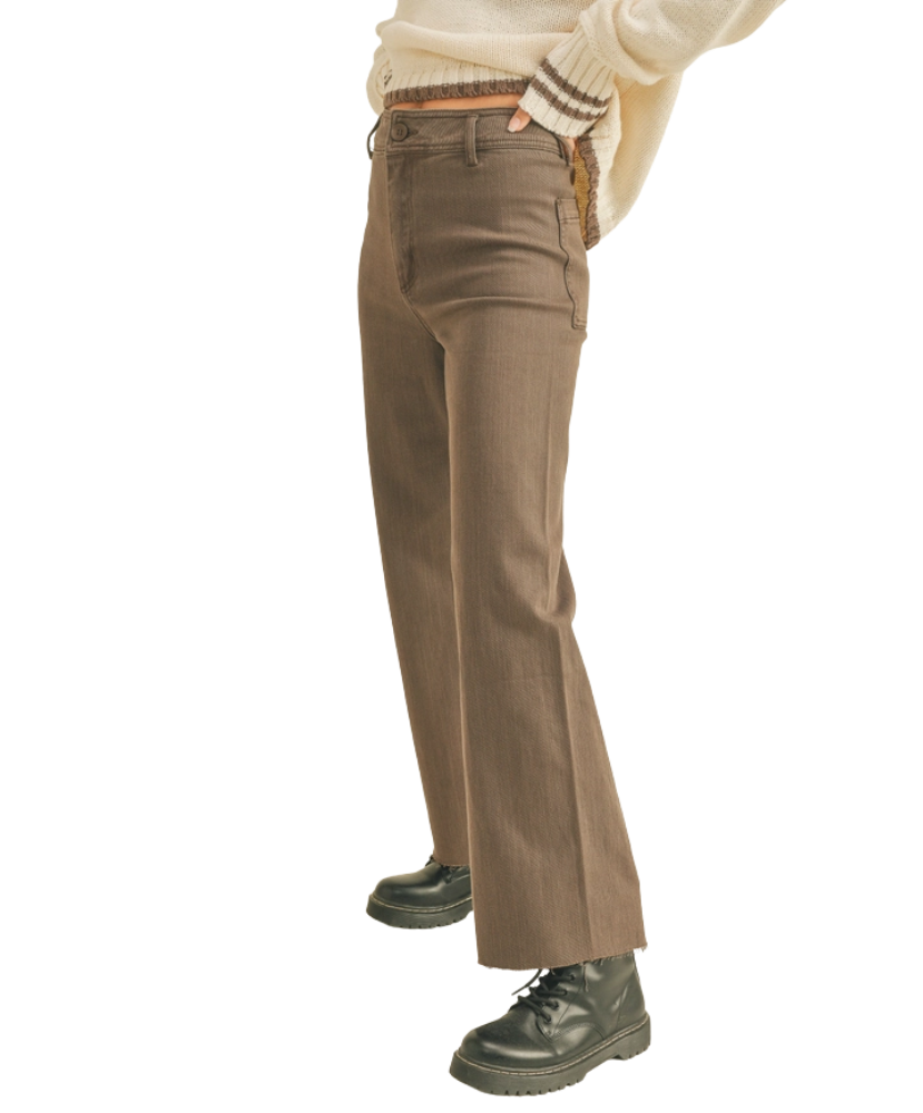 Brown pants worn by a woman on a white background