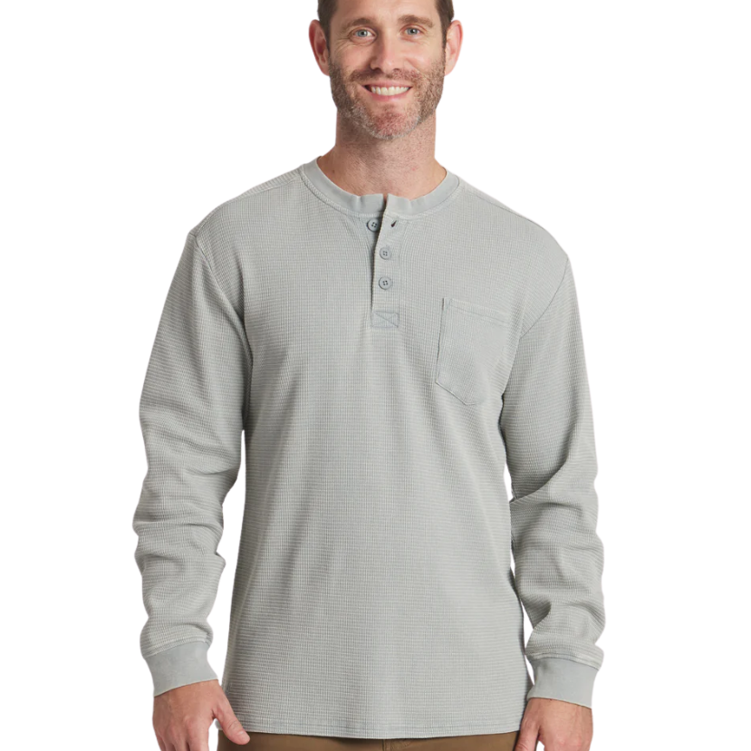 Man wearing a burnt sage long-sleeve henley shirt on a white background