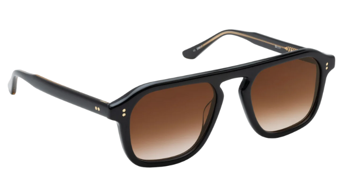 Black Krewe sunglasses with brown gradient lenses on a white background
