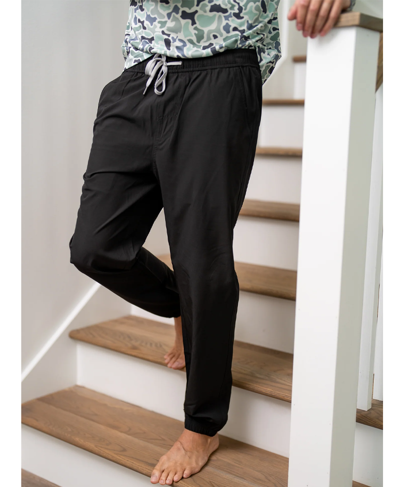 A pair of black men's joggers with a drawstring.