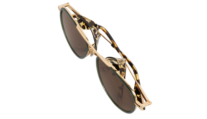 Gold-framed Krewe sunglasses with tortoiseshell pattern on a white background