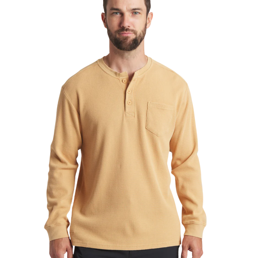 Man wearing a beige long-sleeve henley shirt on a white background