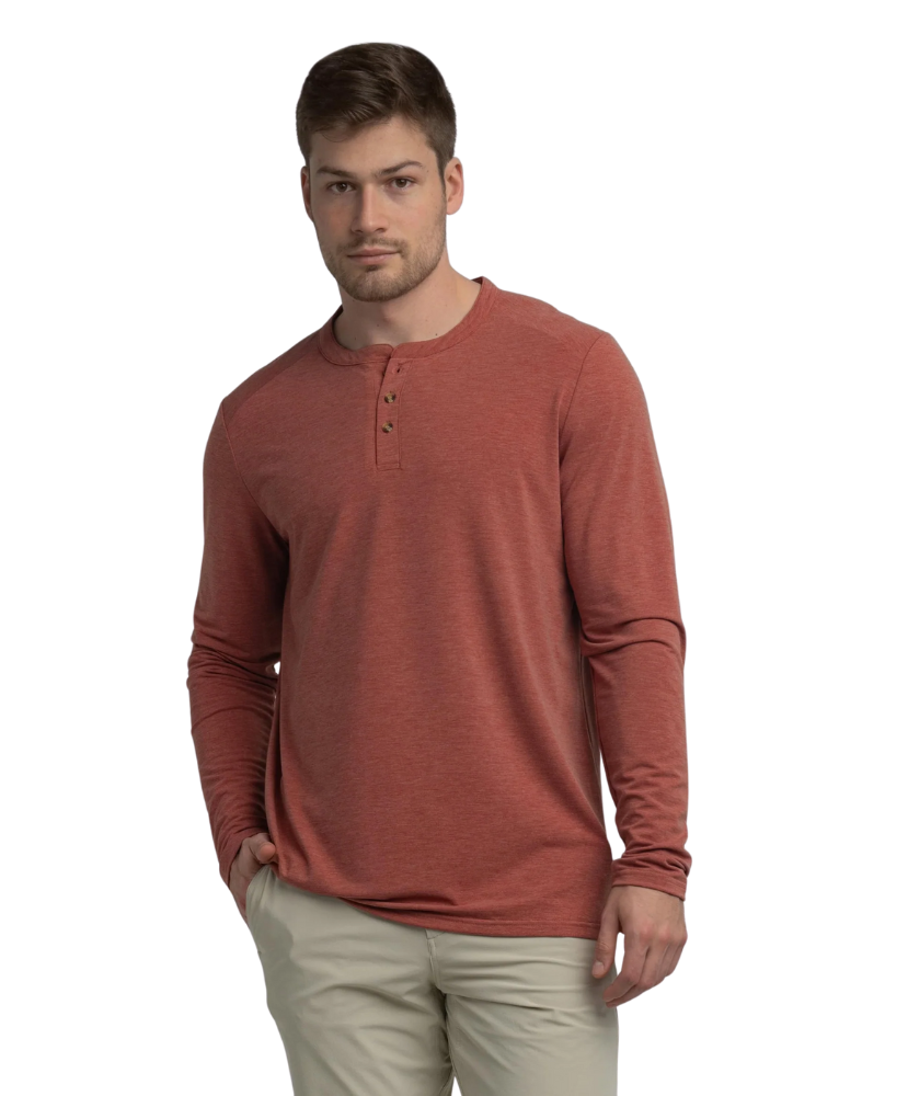 Man wearing a red long-sleeve henley shirt on a white background