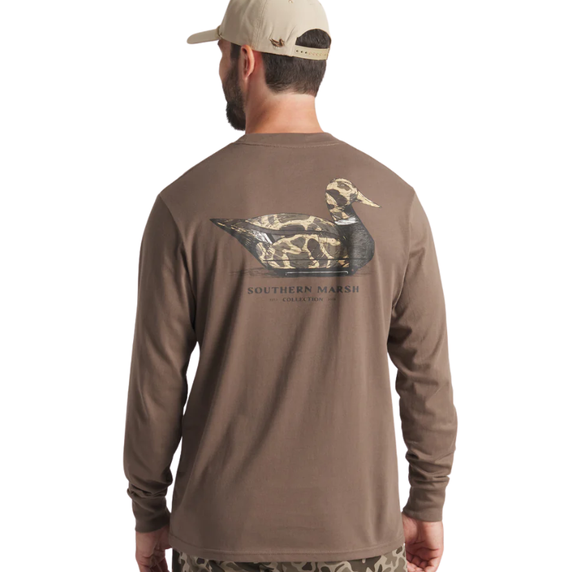 Man wearing a brown long-sleeve shirt with a duck logo on the back, standing against a white background.