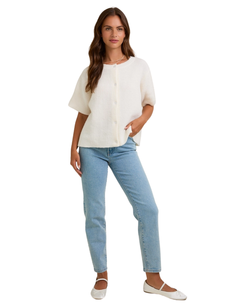 Woman wearing a white blouse and light blue jeans on a white background