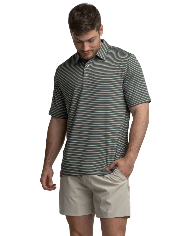 Man wearing a striped polo shirt and beige shorts on a white background
