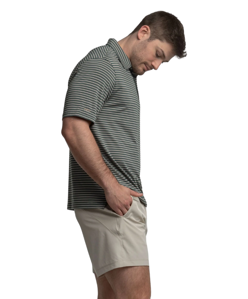 Man wearing a striped shirt and beige shorts on a white background
