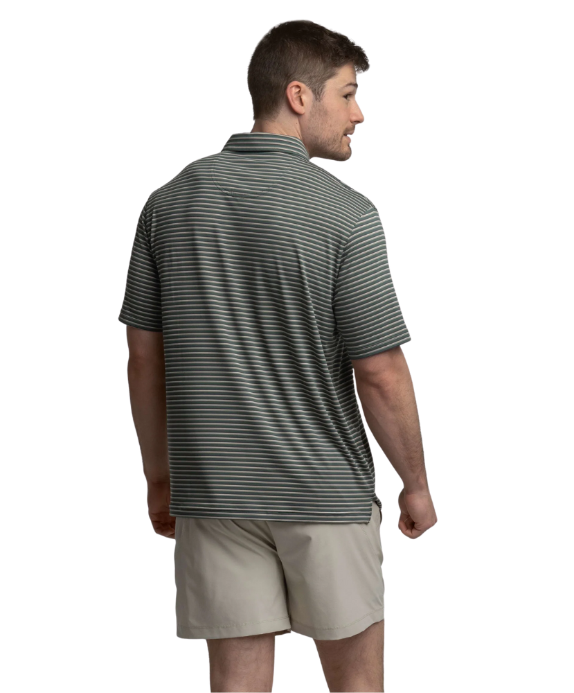 Man wearing a striped polo shirt and beige shorts on a white background