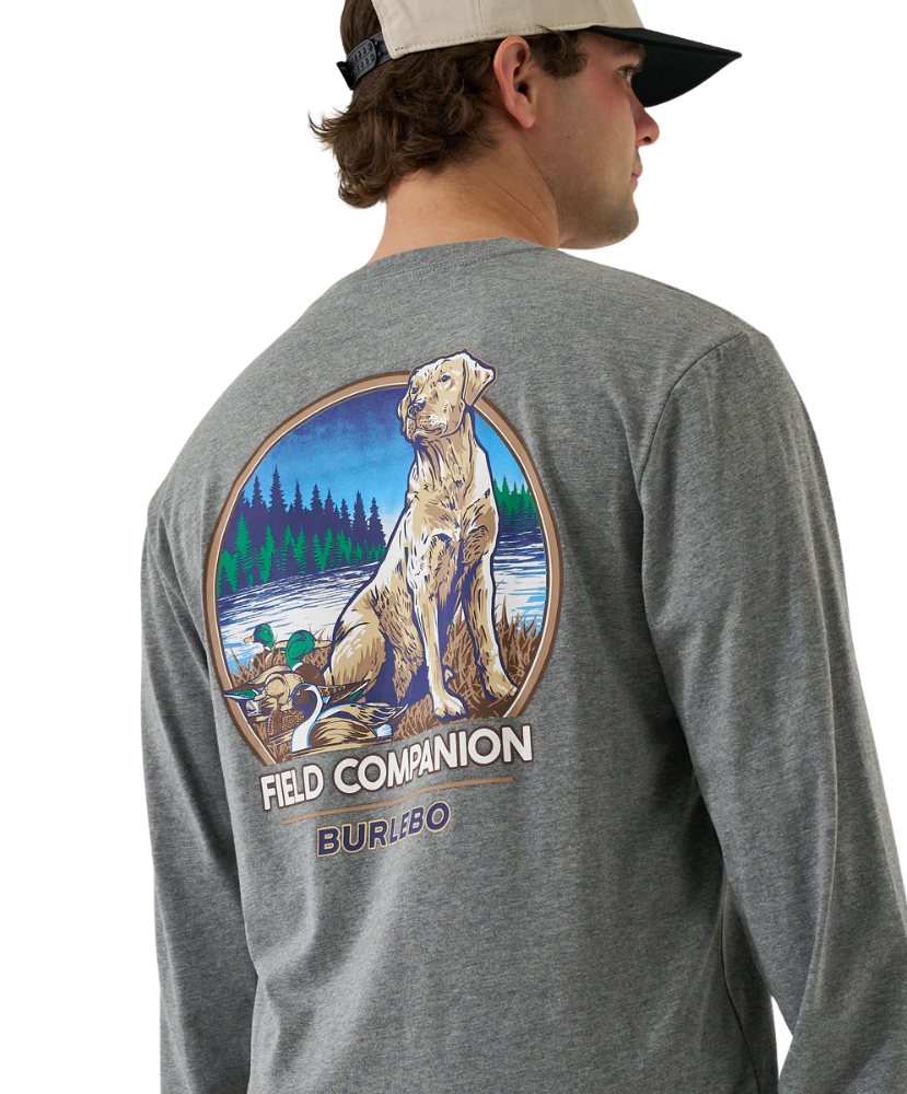 Gray long-sleeve shirt with a dog and nature graphic on the back, worn by a person.