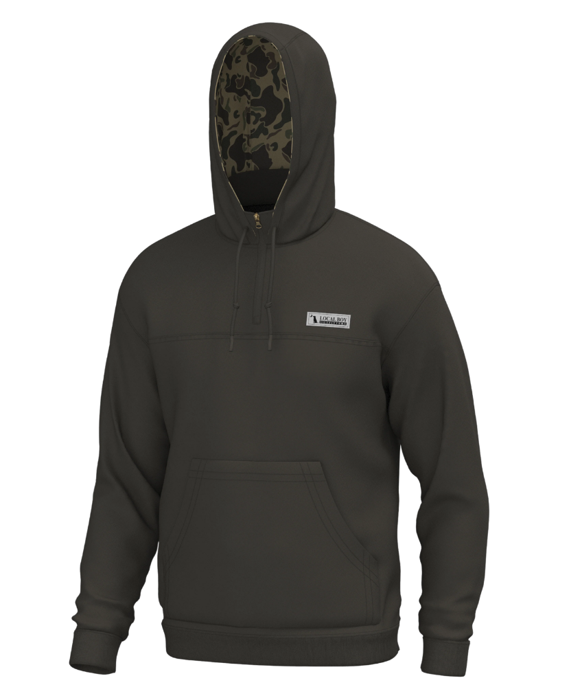 A BROWN pullover hoodie with a drawstring hood, kangaroo pocket, and a small white rectangular logo patch on the left chest. The inside of the hood features a contrasting camouflage pattern.