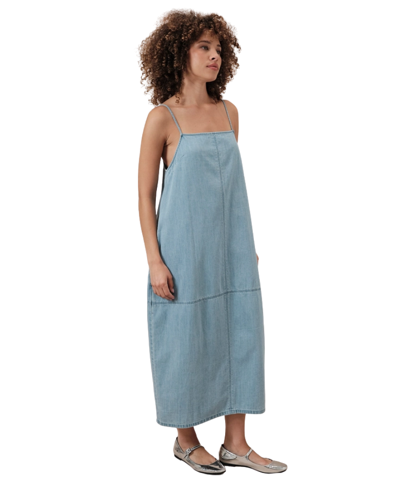 Woman wearing a light blue dress on a white background