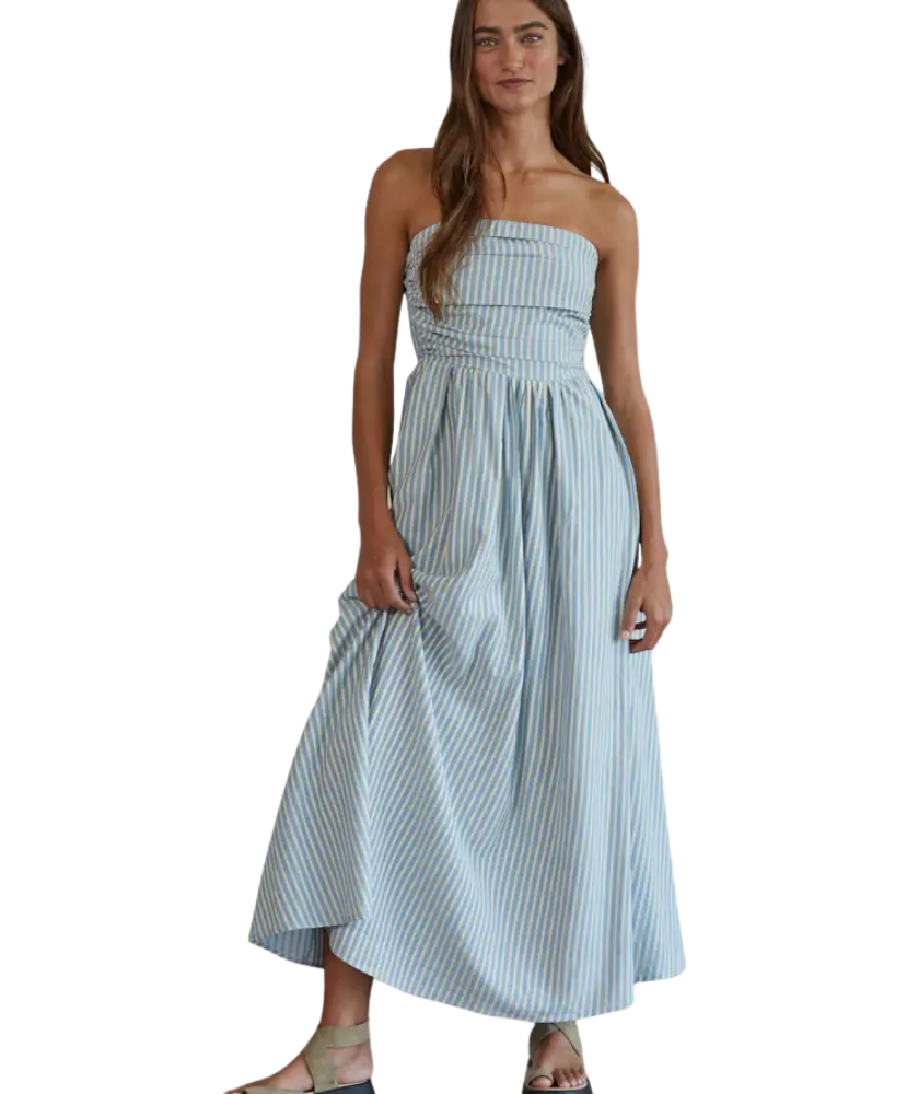 Woman wearing a light blue striped dress on a white background