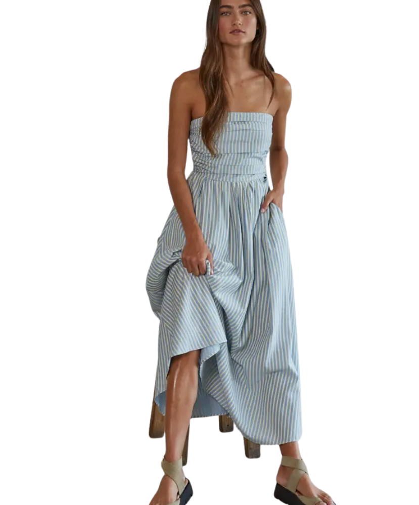 Woman wearing a light blue striped dress on a white background