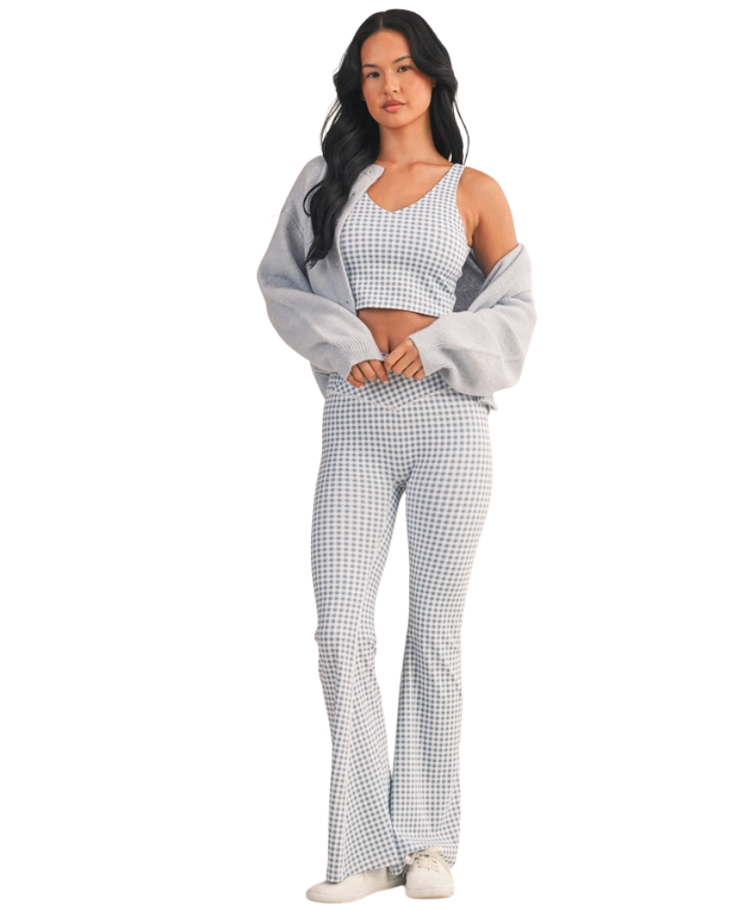 Woman wearing a light blue and white GINGHAM checkered tank on a white background